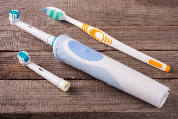 Ask A Dentist: Are Electric Toothbrushes Really Better For Your Teeth?